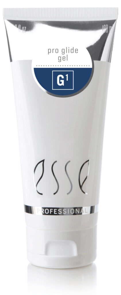 A white tube labeled “Esse Professional Pro Glide Gel G1” with a silver band near the bottom and a blue circular label on the upper section.